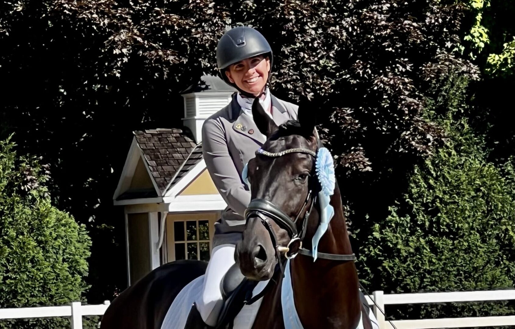 A woman riding on the back of a horse.